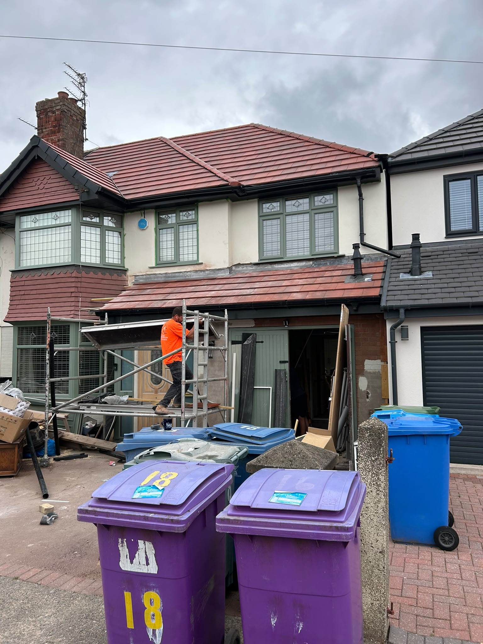 Front elevation re-roof with red clay tiles and scaffolding
