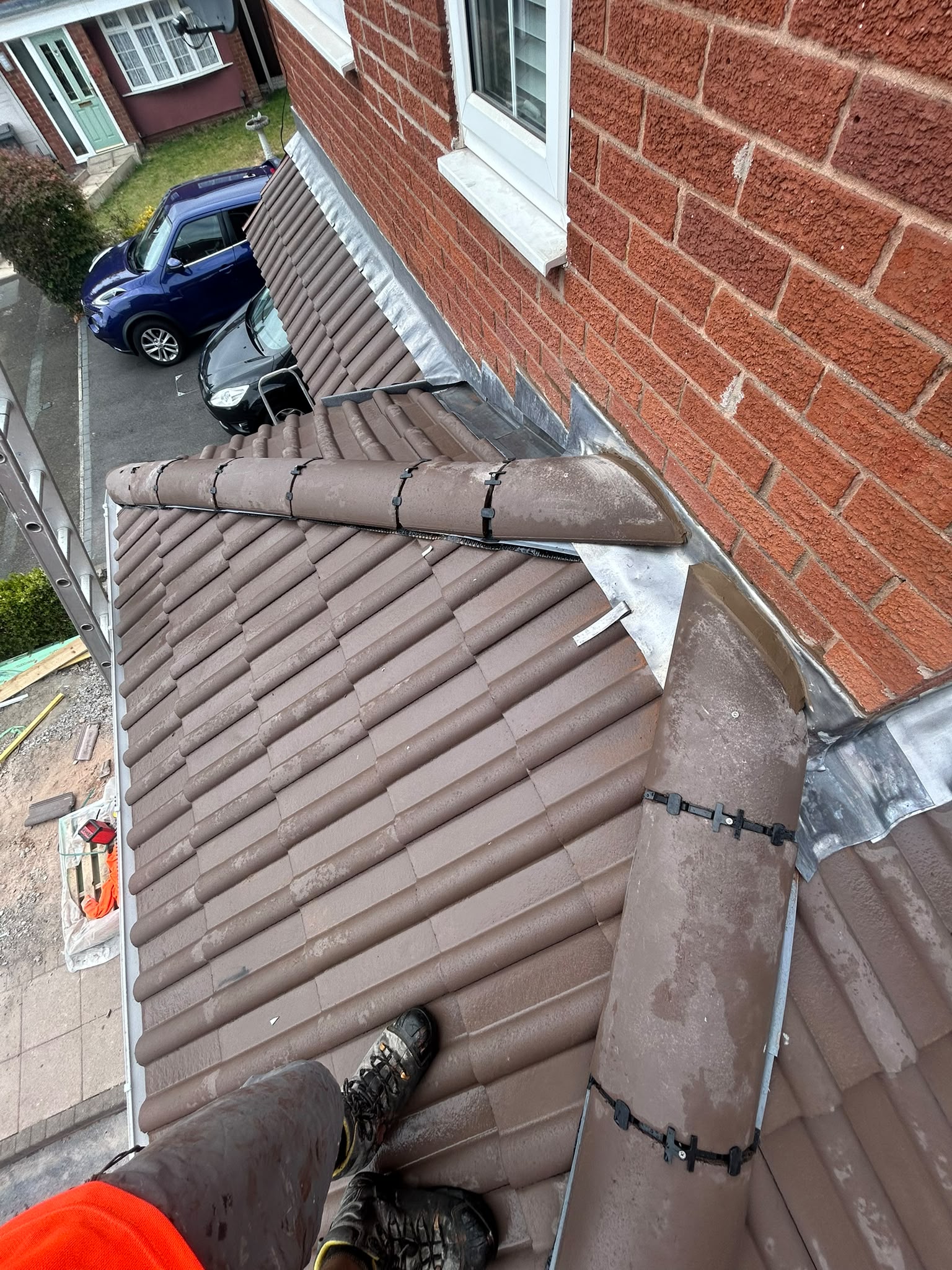 Ridge tile and lead flashing detail on a sloped roof