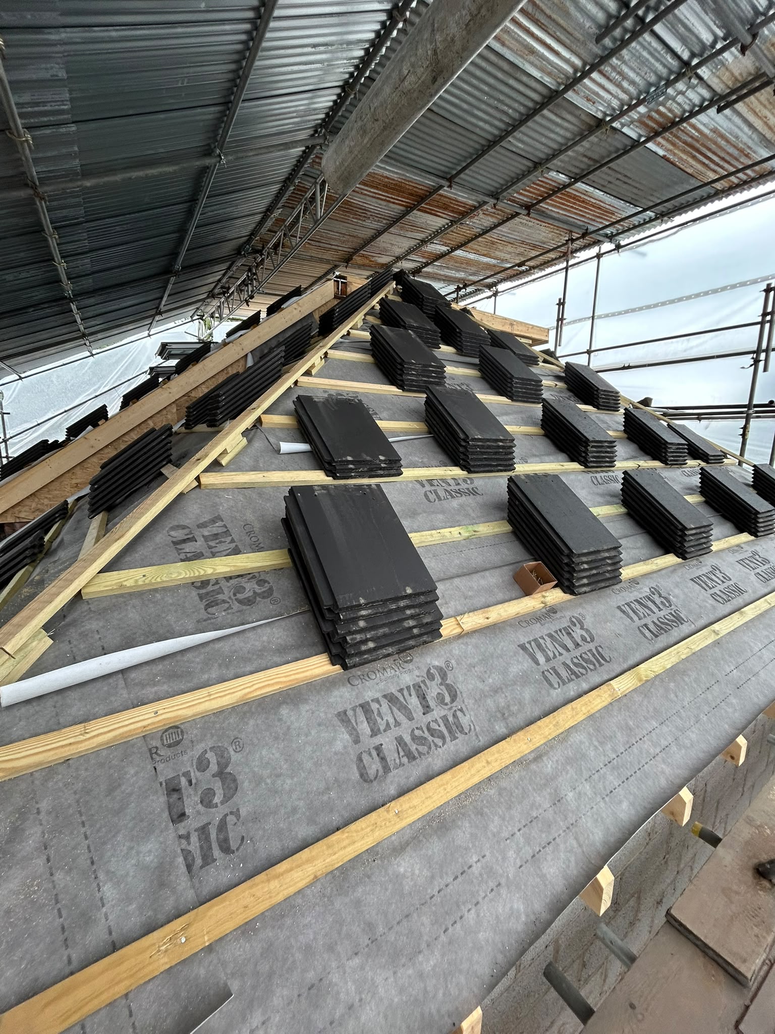 Cromar Vent3 membrane with charcoal tiles staged under temporary roof